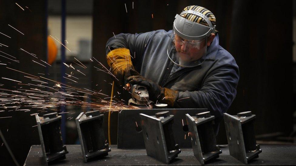 Worker at bridge components factory