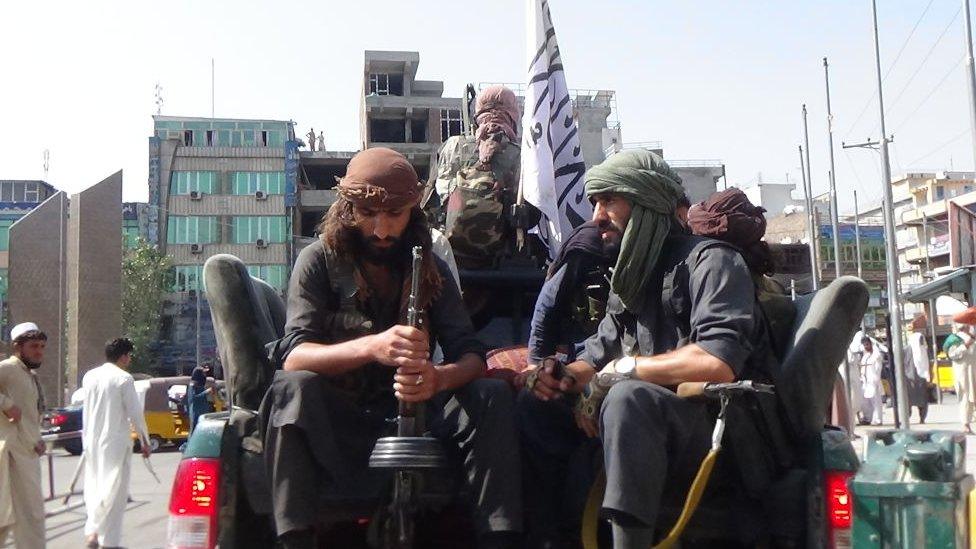 Taliban soldiers patrol the streets of Jalalabad on 17 April