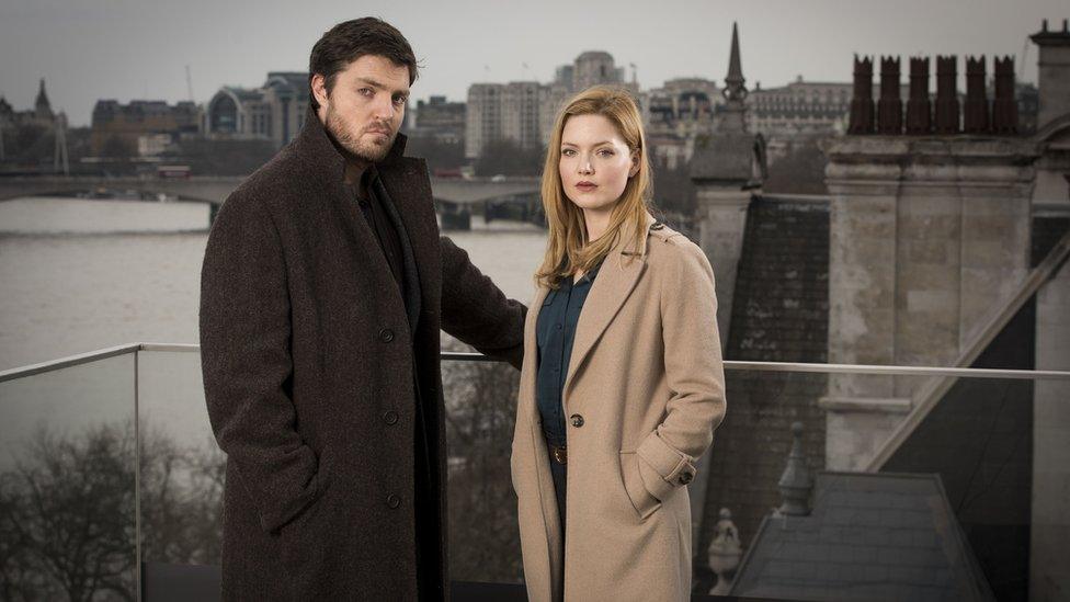 Tom Burke as Cormoran Strike and Holliday Grainger as Robin Ellacott