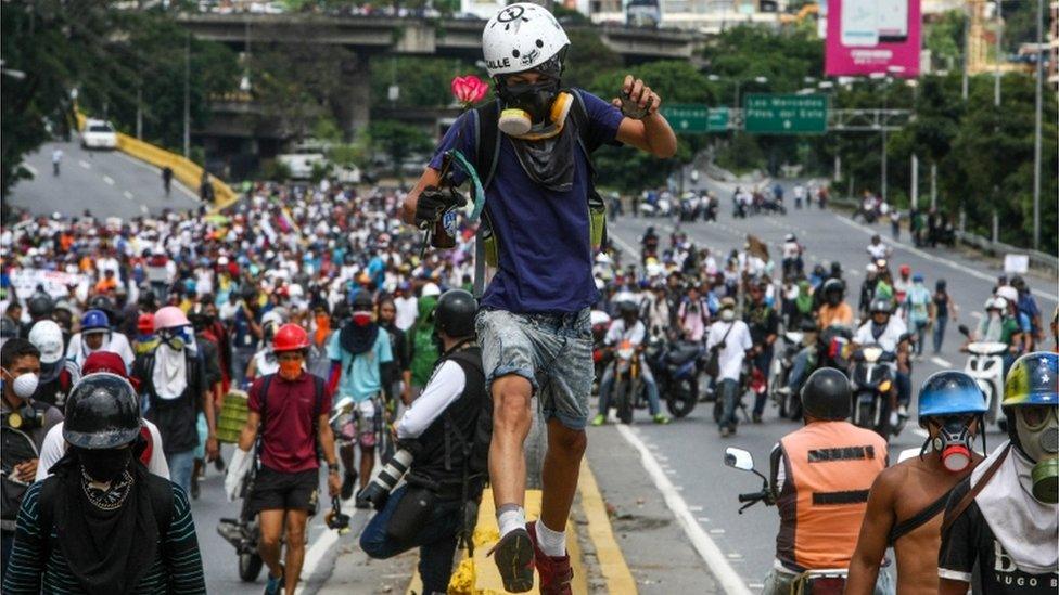 Opposition sympathizers participate in a protest against the Government in Caracas, Venezuela