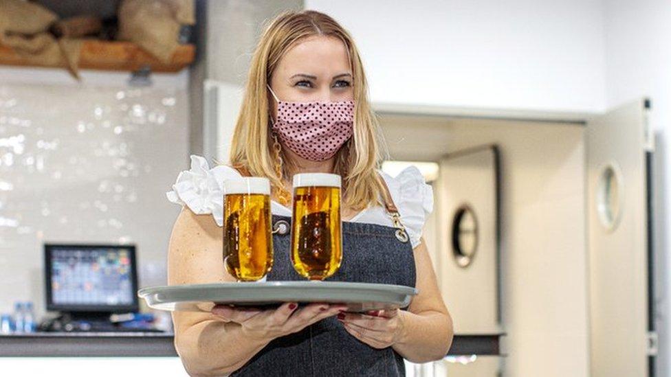 Waitress wearing face mask