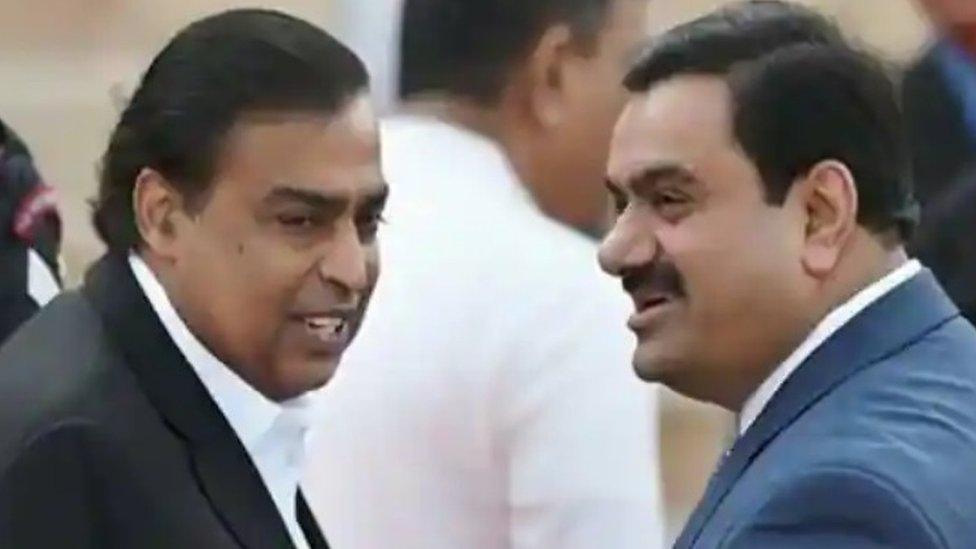 Mukesh Ambai, left, and Gautam Adani are two of Asia's richest men