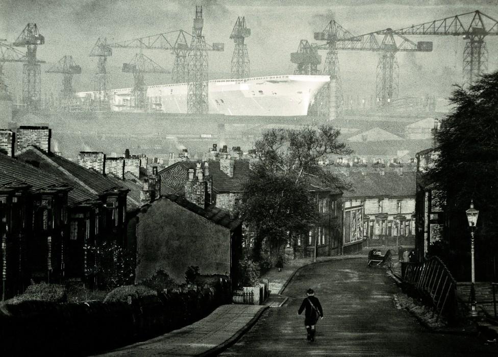 The Ark Royal being built, as seen from a terraced street