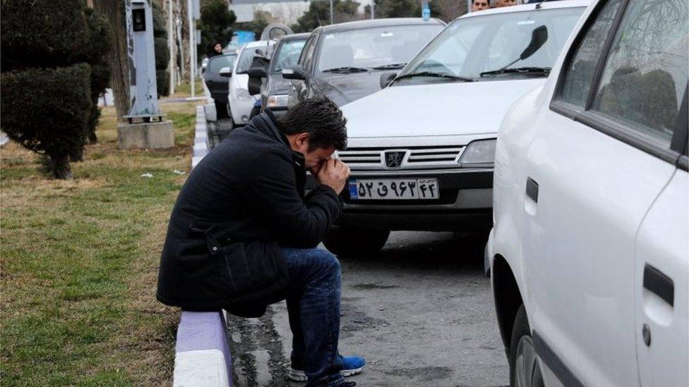 Grieving relatives at Mehrabad airport in Tehran following the Aseman air crash in which dozens are feared dead, 18 February