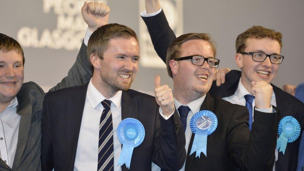 Conservative party members celebrate winning a seat in the Shettleston area of Glasgow