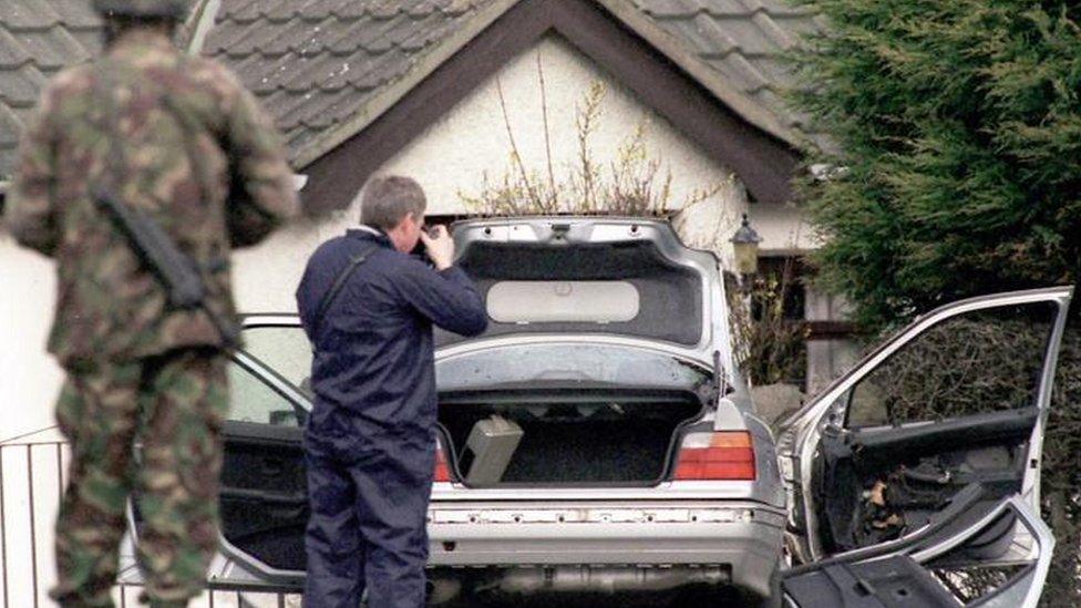 British soldiers examine the bomb scene in Lurgan, Northern Ireland where high profile catholic lawyer Rosemary Nelson was killed by booby-trap bomb which exploded under her BMW, Monday March 15,1999