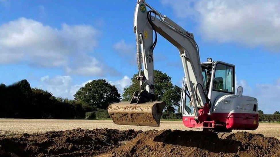 A digger on the land at Colkirk