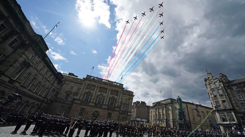 Red Arrow planes fly over Parliament square in Edinburgh