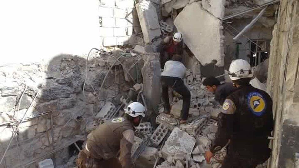 Syria Civil Defence rescue workers at scene of reported air strike in village of Haas, Syria (26 October 2016)