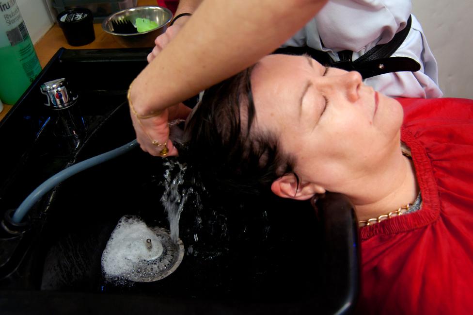 A woman having her hair washed