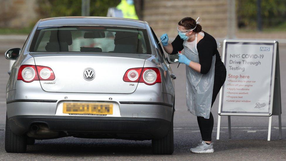 Medical staff testing people at a drive-through centre