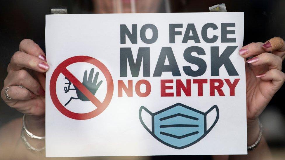 No face mask sign