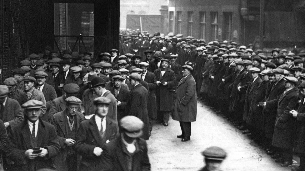 A huge crowd of labourers gathers at the London docks in March 1931 in the hopes of getting some work