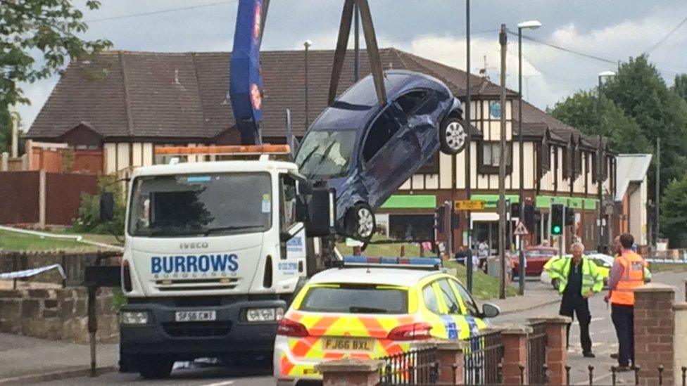 Crashed car being recovered