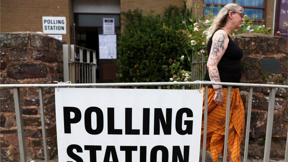 A woman leaving a polling station