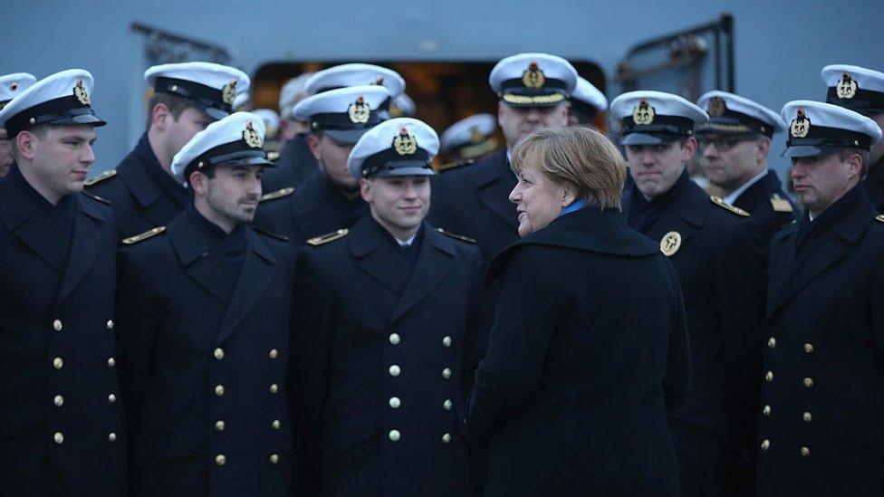 German Chancellor Angela Merkel talks to sailors of the German Navy while she visited the 'Braunschweig' warship on January 19, 2016 in Kiel, Germany.