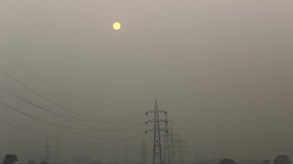 High tension electric pylons are pictured on a smoggy day in New Delhi, India, November 30, 2015