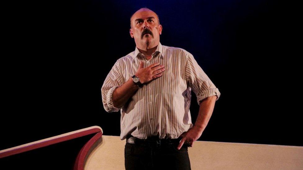 Paul Garret as David Ervine on stage