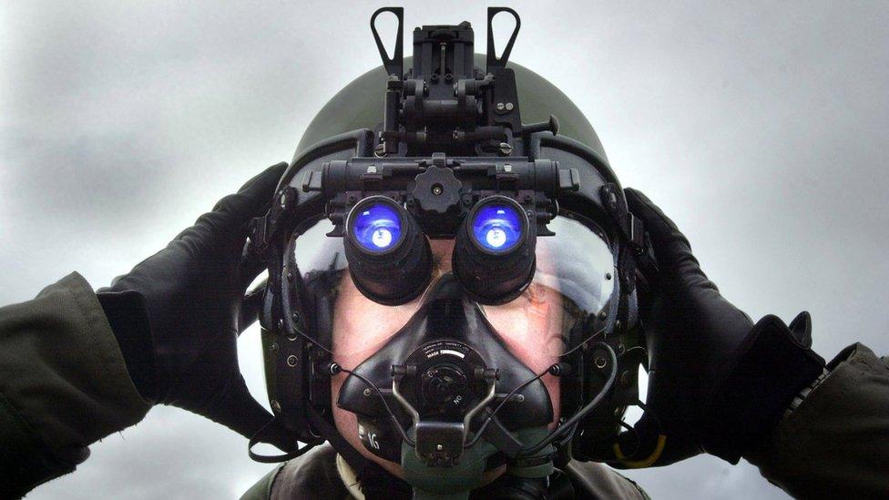 A pilot at RAF Lossiemouth, Scotland, wearing night vision device