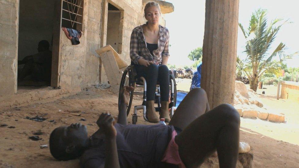 Sophie with Grace who is lying on the floor after drinking a "medicine"