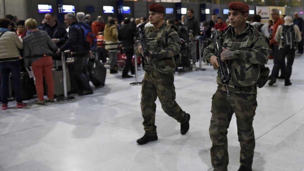 Soldiers patrol at Charles de Gaulle airport as part of security measures in the wake of the atrocity