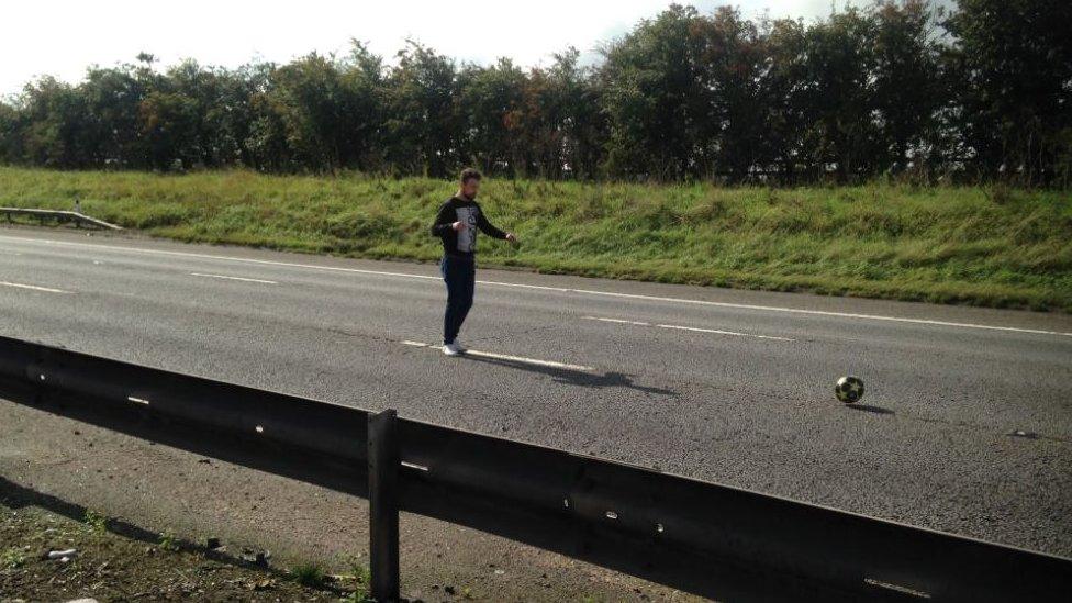 Man playing football on empty M1