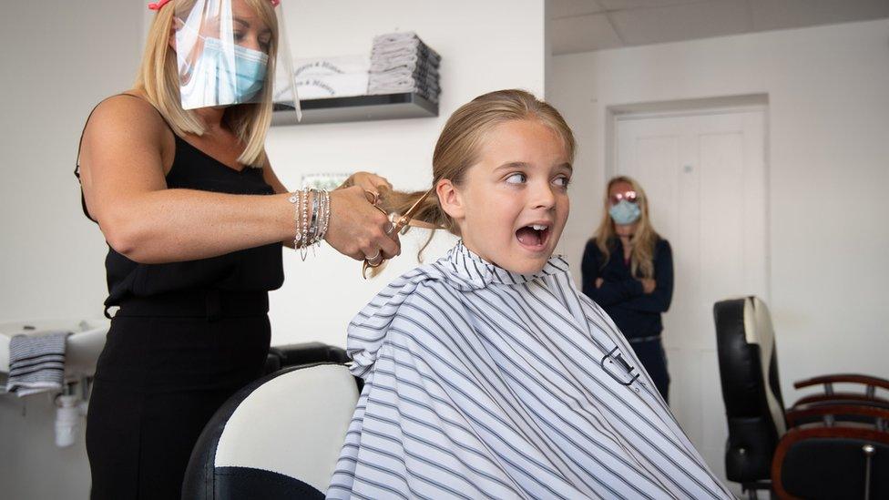 Reilly Stancombe having hair cut