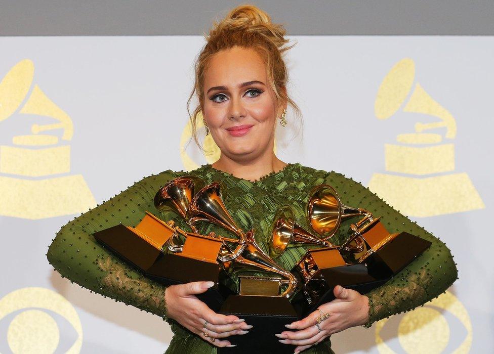 Adele with an armful of Grammys