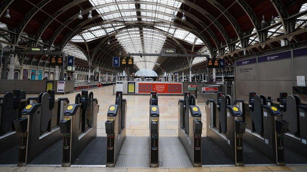 Ticket barriers stand open at an empty Paddington station