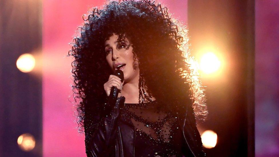 Cher performing