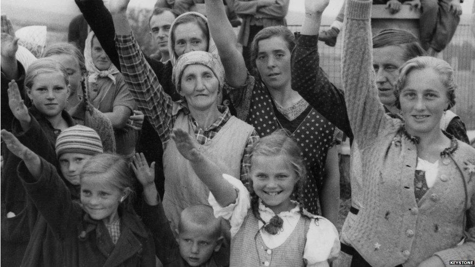 Ethnic Germans welcome the arrival of German troops with Nazi salutes, during the annexation of Zone 1 of the Sudetenland by Nazi Germany (3 October 1938)