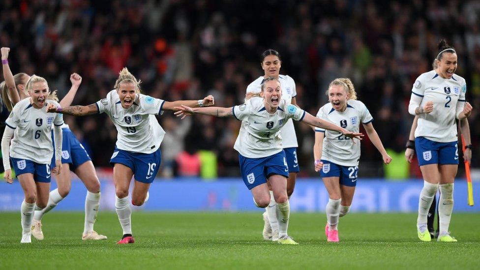 The Lionesses run towards the fans as Chloe Kelly scores the winning penalty