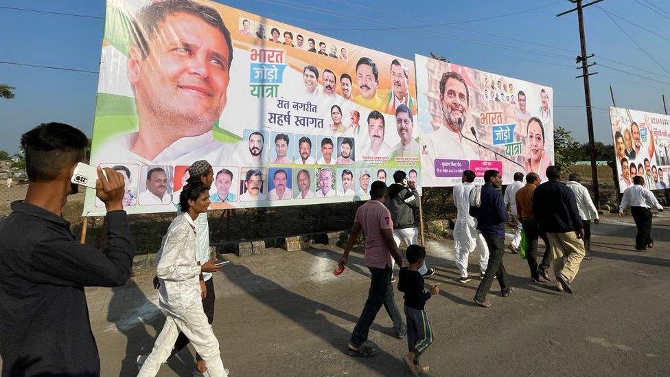 Billboards line the roads through which the march passes