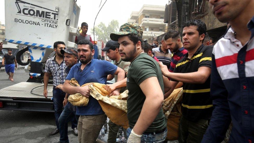 Rescuers at the site of the bomb, 4 July