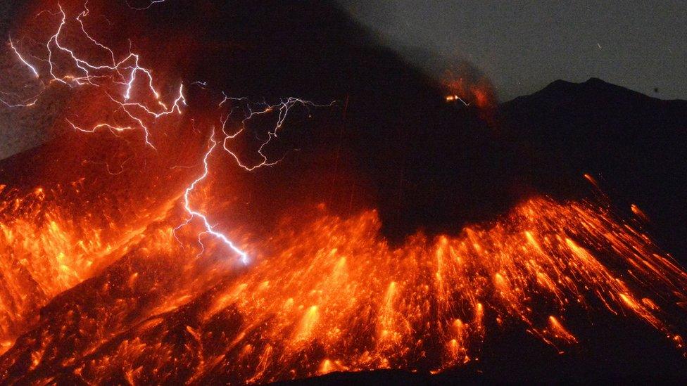 Lightning flashes above flowing lava as Sakurajima erupts in southern Japan