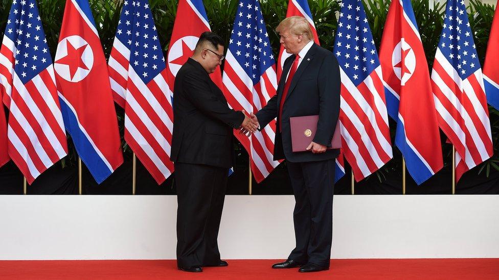 Kim Jong-un and Donald Trump shaking hands