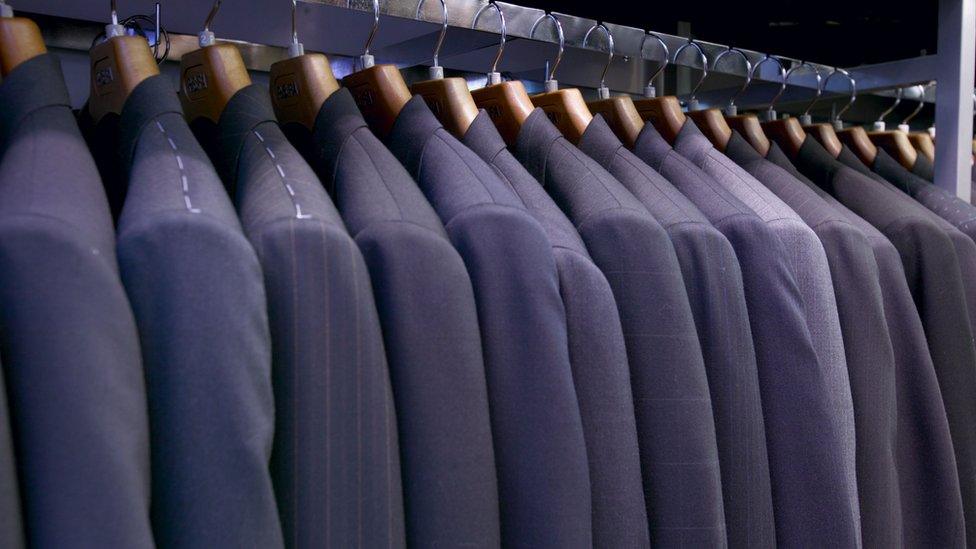 Suits hanging on a rack