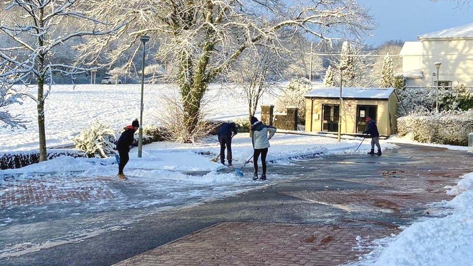 volunteers cleared pathways so a Covid vaccine pilot in Maesteg could keep running