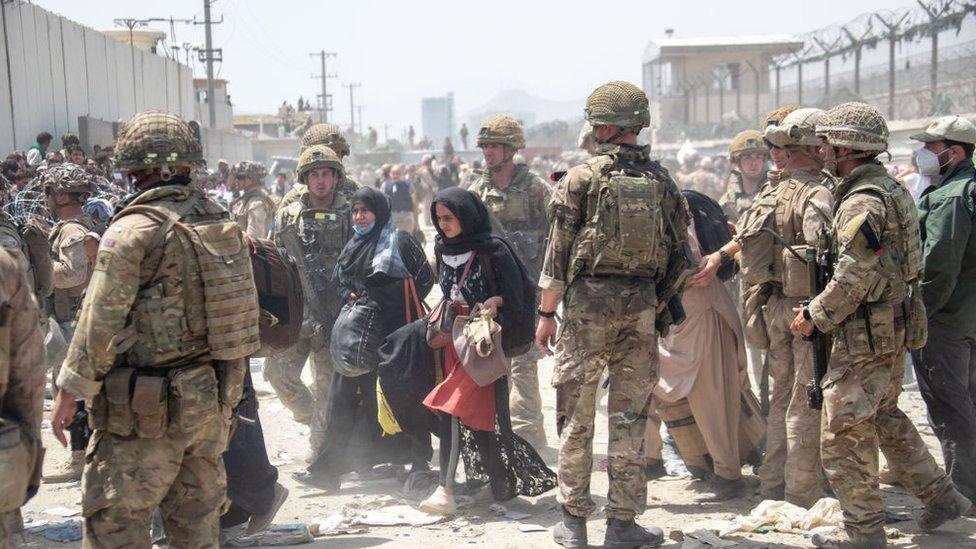 handout image provided by the Ministry of Defence, the British armed forces work with the U.S. military to evacuate eligible civilians and their families out of the country on August 21, 2021 in Kabul,