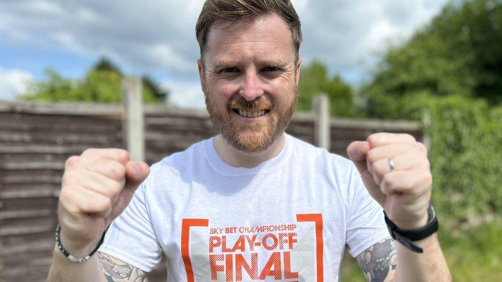 Alex Roberts from Luton wearing a Play-off final t-shirt