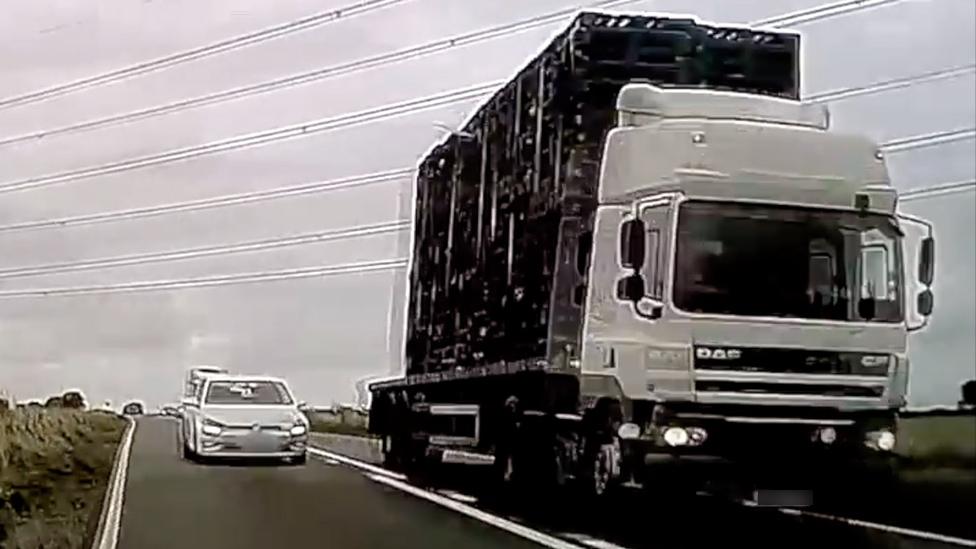 Car overtaking HGV