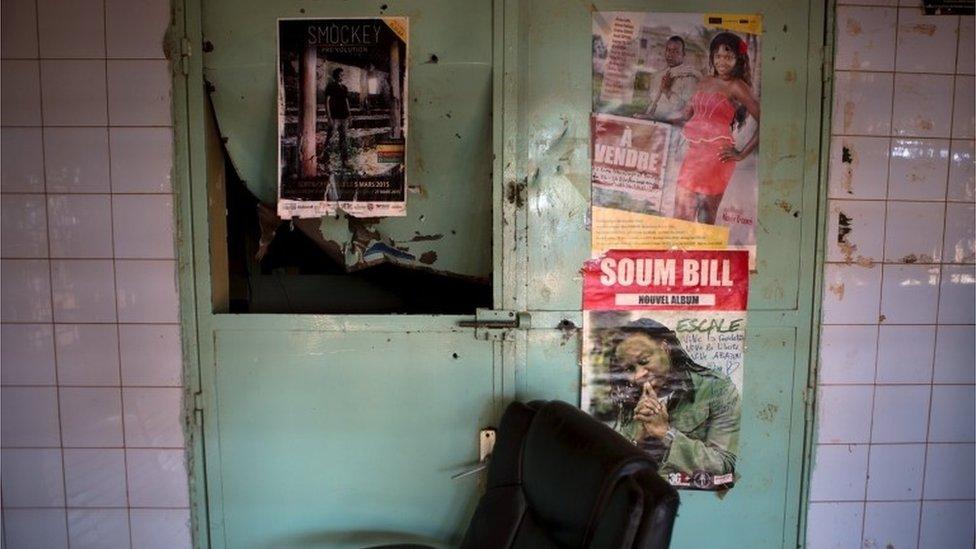 The damaged entrance of rapper and activist Smockey"s recording studio, which according to neighbours was attacked by members of the presidential guard, is seen in Ouagadougou, Burkina Faso, September 17, 2015