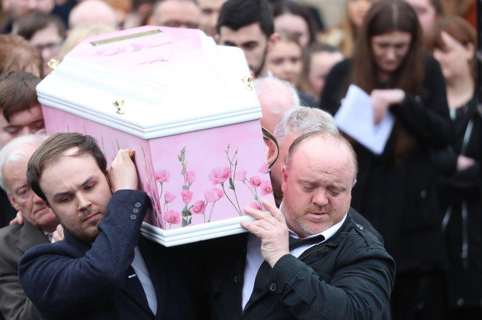 Undertakers take Lauren Bullock's coffin out of a hearse