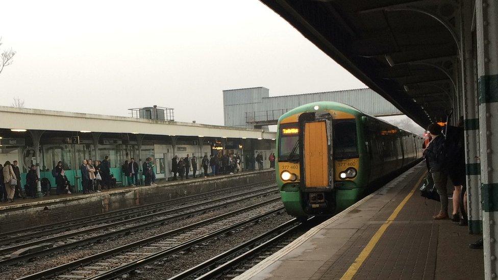 Commuters awaiting a Southern train at Redhill