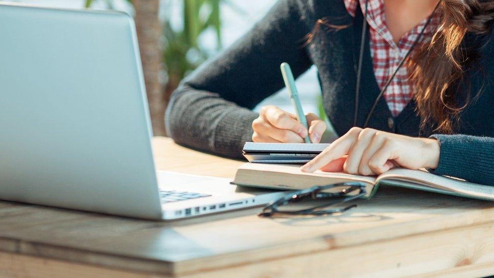 Stock image of woman working at laptop