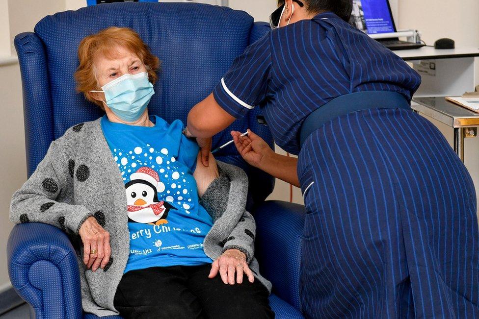 Margaret Keenan, 90, is the first patient in Britain to receive the Pfizer/BioNtech COVID-19 vaccine at University Hospital, administered by nurse May Parsons, at the start of the largest ever immunisation programme in British history, in Coventry, 8 December 2020.