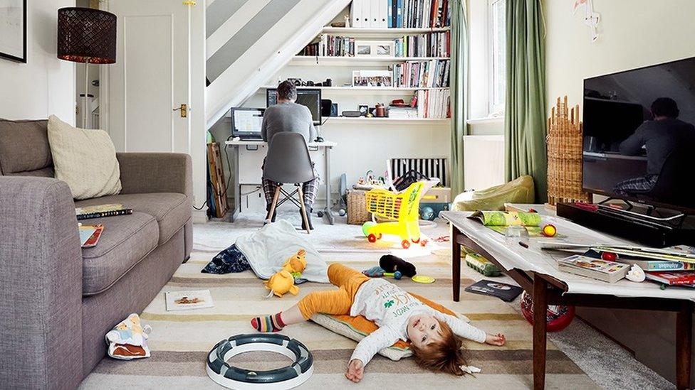 toddler-and-dad-in-messy-living-room.