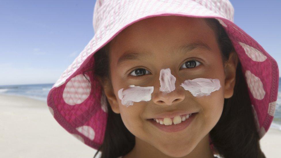 Girl with sunscreen on