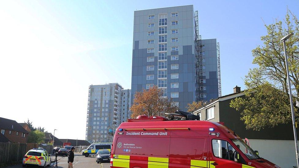 Police vehicles outside block of flats after fire