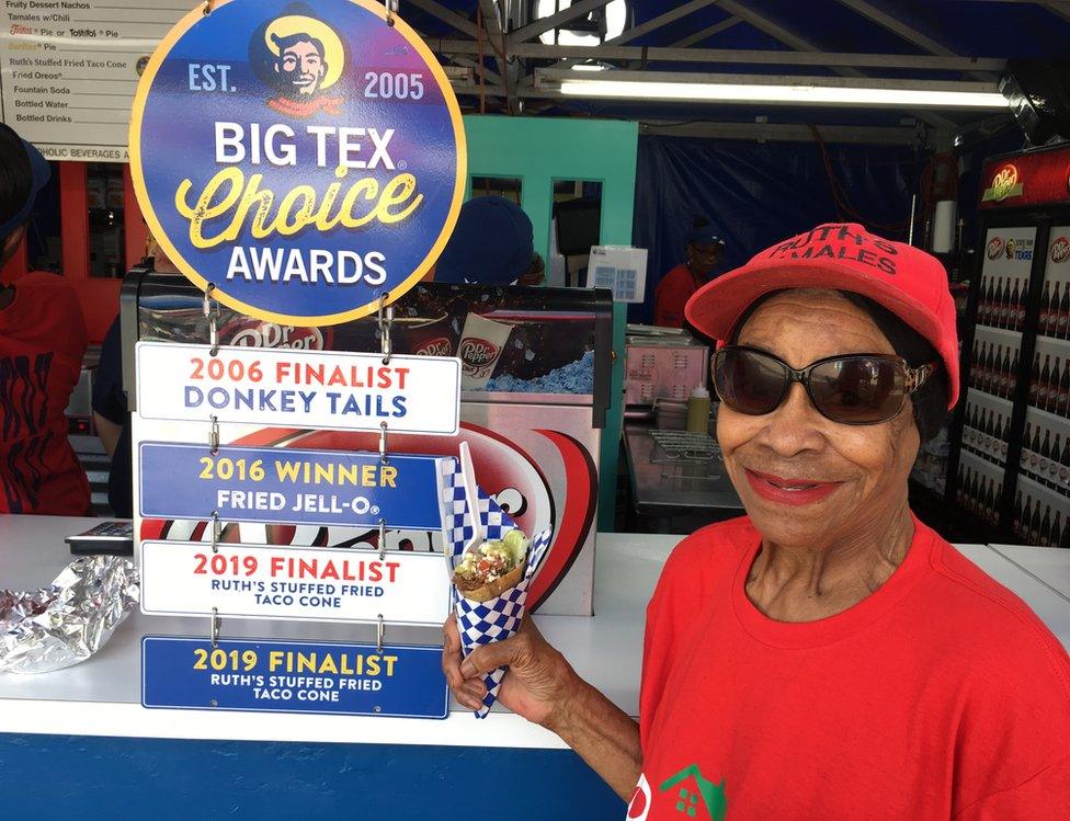 A woman poses with a stuffed fried Mexi-cone